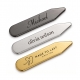 Gunmetal, silver, and gold metal collar stays displaying different engraved names and logo designs
