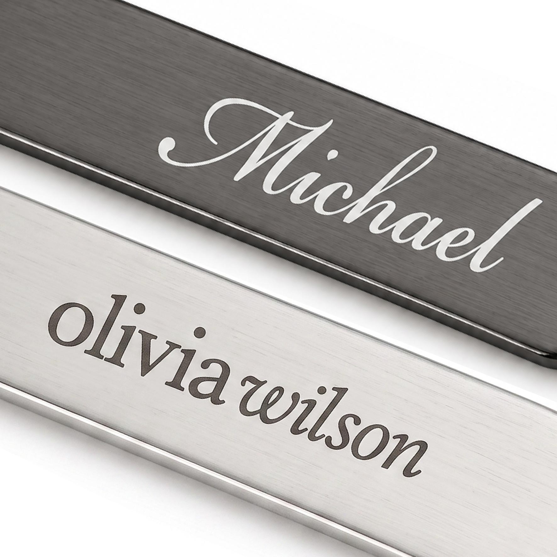 Close-up of laser engraved logos on silver and gunmetal collar stays