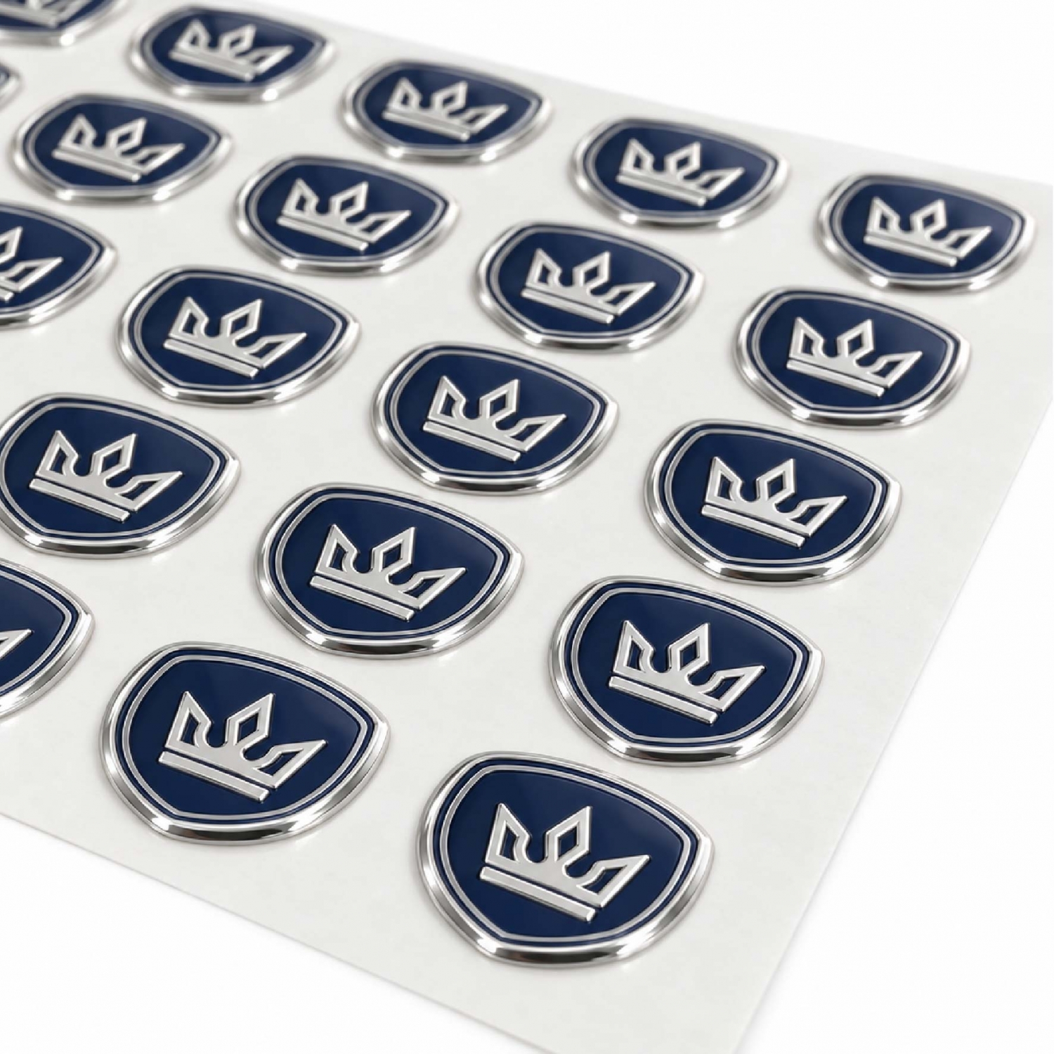 Raised nickel stickers with silver borders and blue details arranged together for bulk production